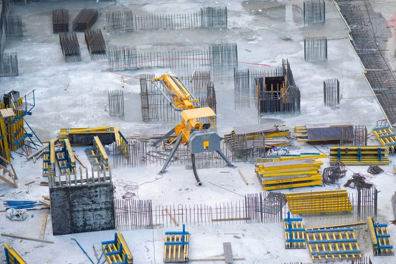 Aerial construction progress photography of an active job site with machinery in Central Florida