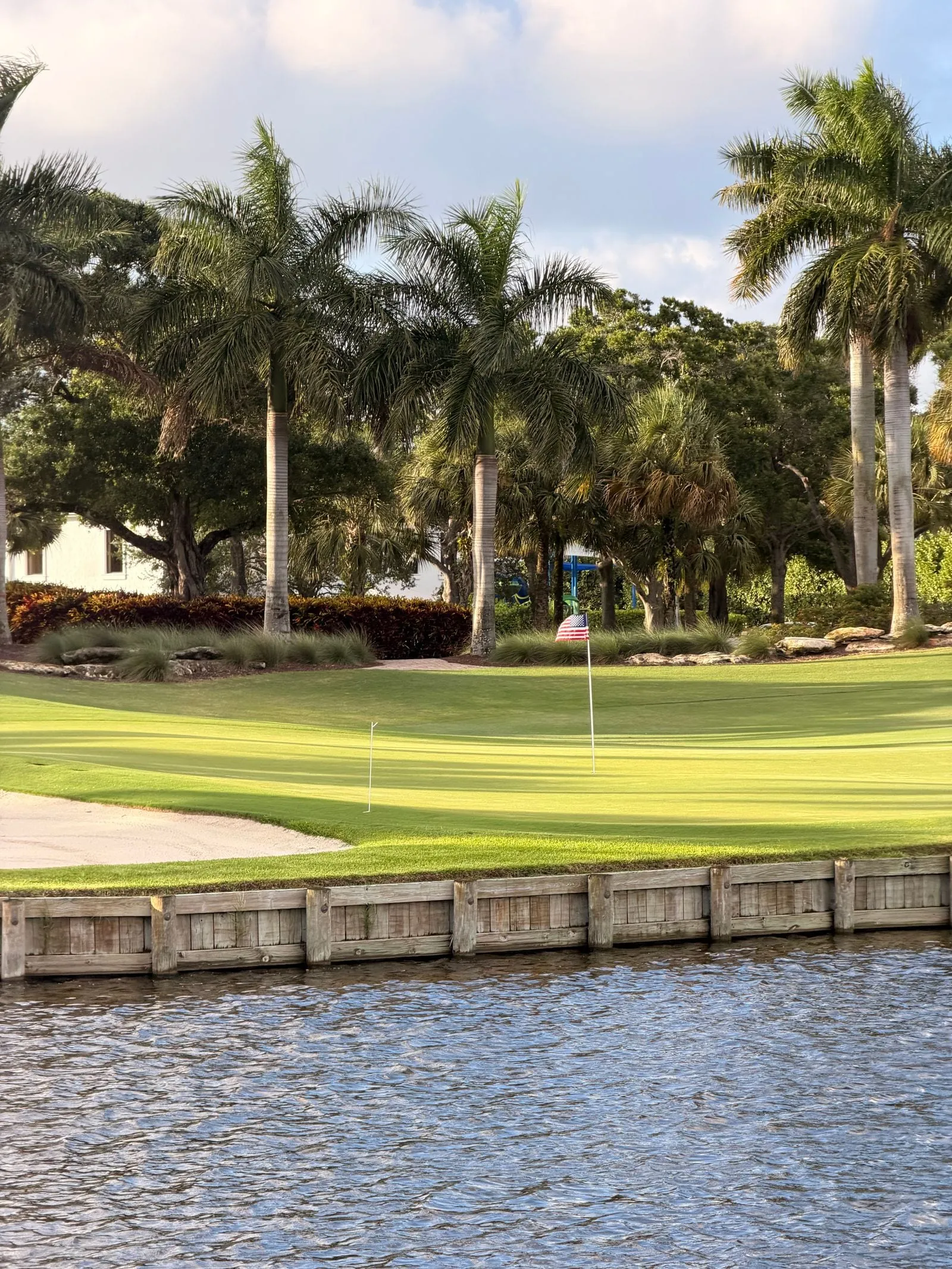 Golfer lining up a putt on a sunny Central Florida course